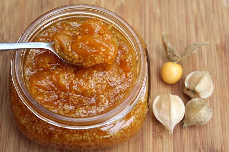 Open jar of homemade husk cherry jam