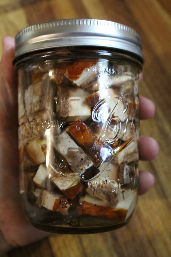 Chopped reishi mushrooms in vodka for tincture