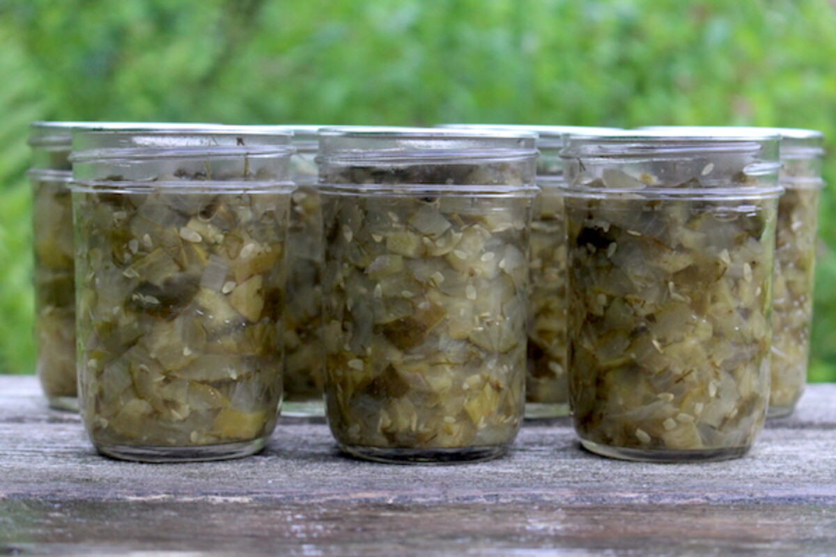 Home canned dill pickle relish ~ The results of using this canning recipe for dill pickle relish displayed on a table top.
