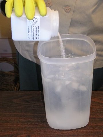 Pouring lye into distilled water