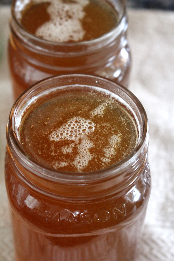 Fill maple syrup jars nearly to the top, leaving as little headspace as possible (without slopping it on the rim). Somewhere around 1/4 to 1/8th inch is ideal. This will help the jar seal quickly and ensure that the air in the jar is sterilized by the heat from the syrup itself.