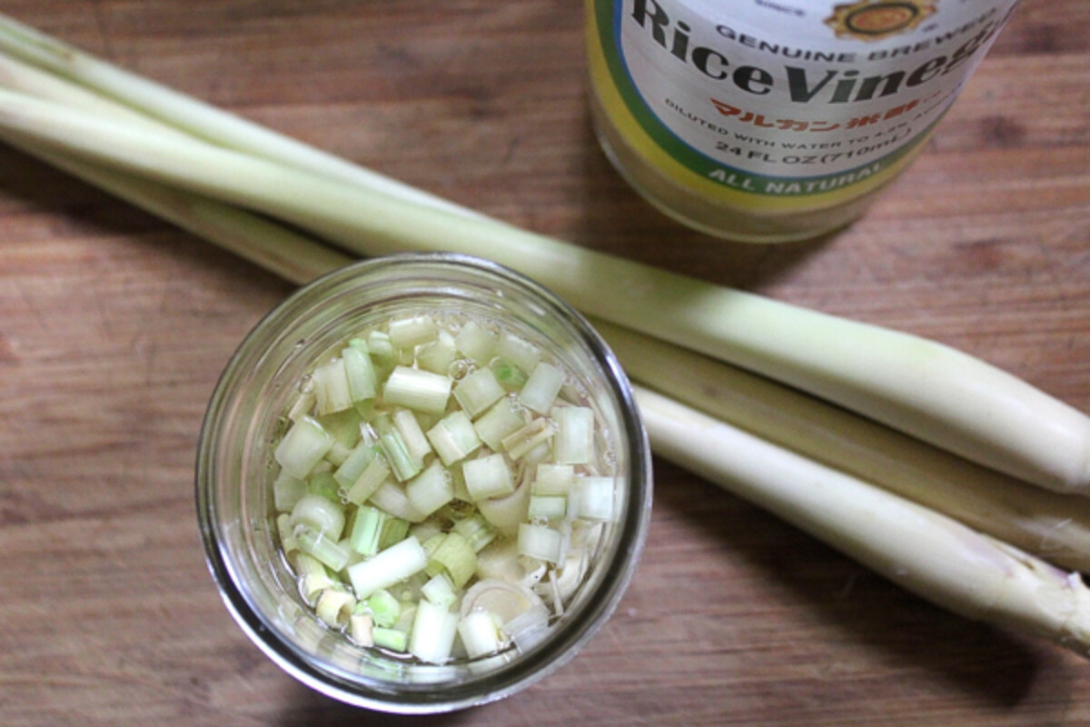 Preserving lemongrass in rice vinegar for winter cooking projects.