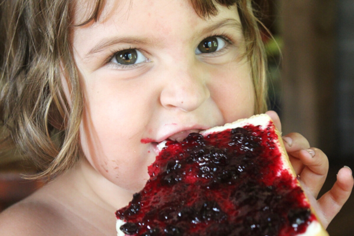 Child Eating Blackcurrant Jam