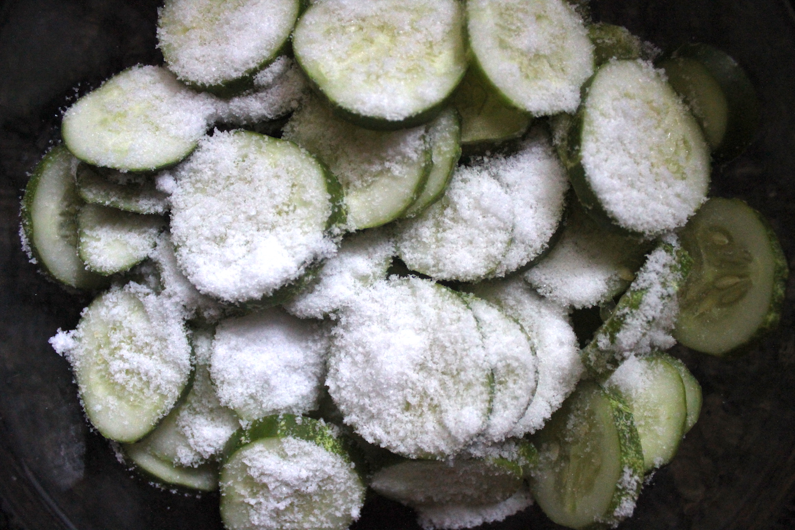 Soaking cucumber slices in salt