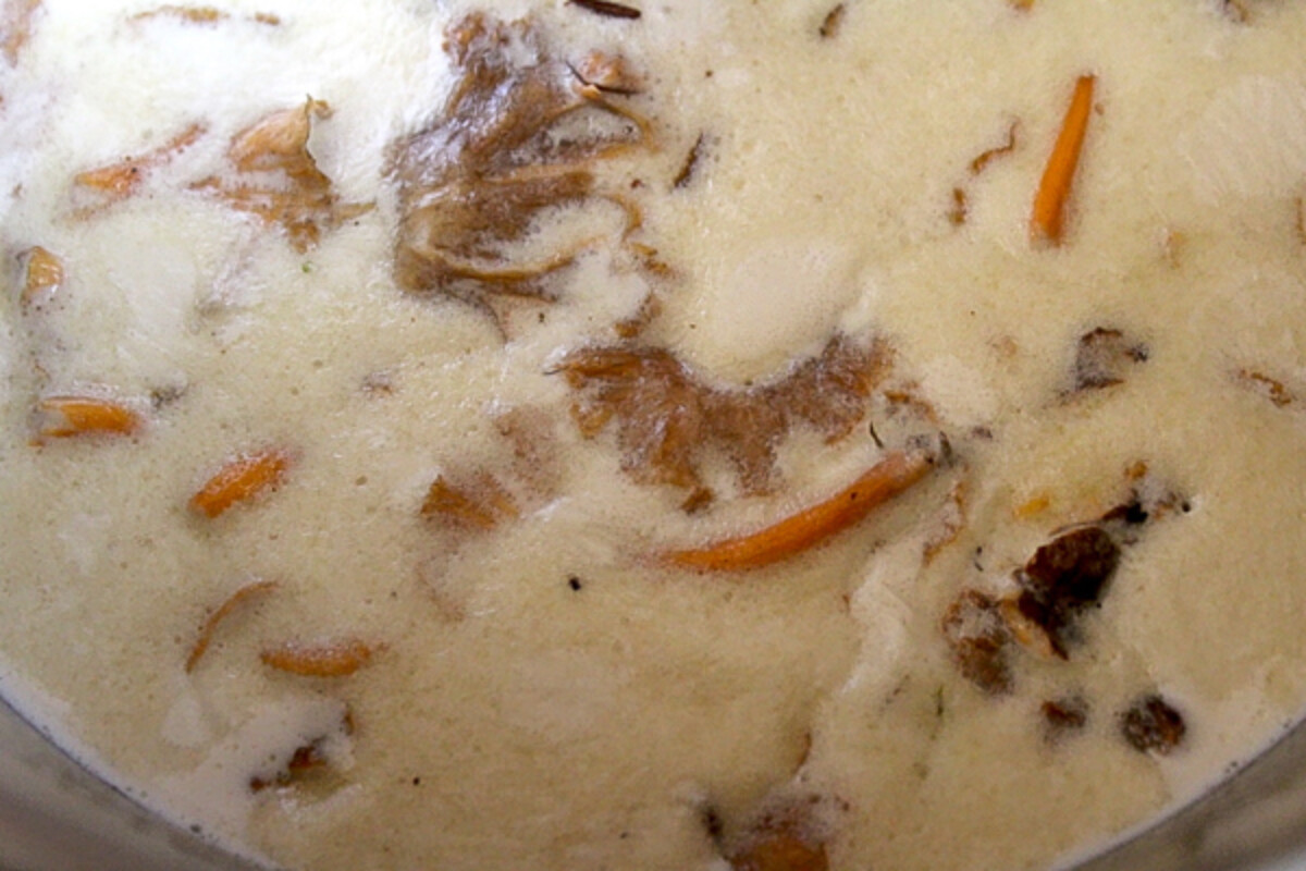 Chanterelles infusing in cream for homemade chanterelle ice cream
