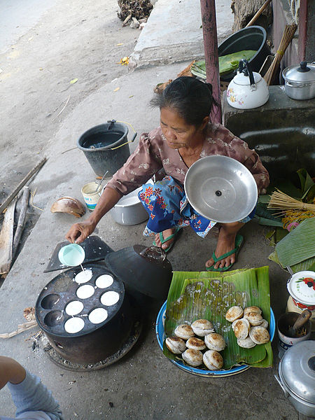 A woman making Serabi in Indonesia.