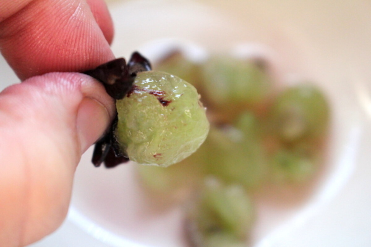 Squeezing Out Grape Pulp from the Skin to Make Seedless Grape Jam