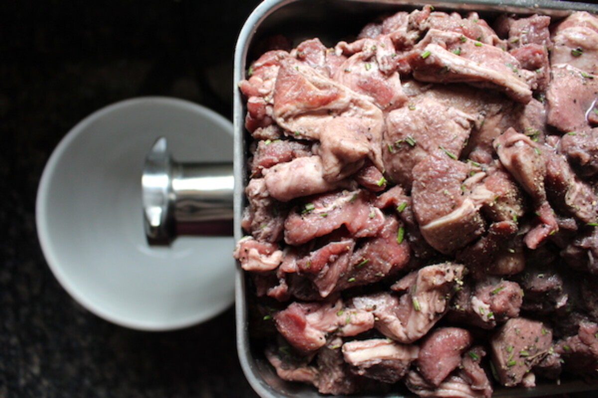 Lamb sausage meat mix, with about 20% fat included. Mix the spices into the meat chunks before grinding.