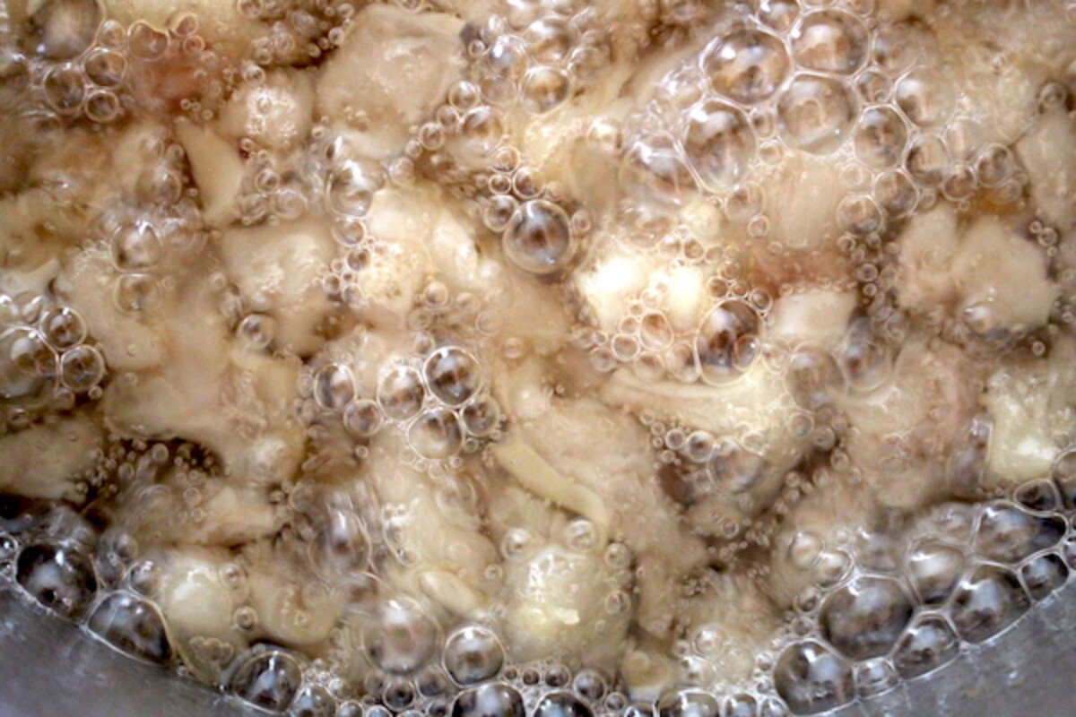 Leaf lard rendering after about 90 minutes on low heat.