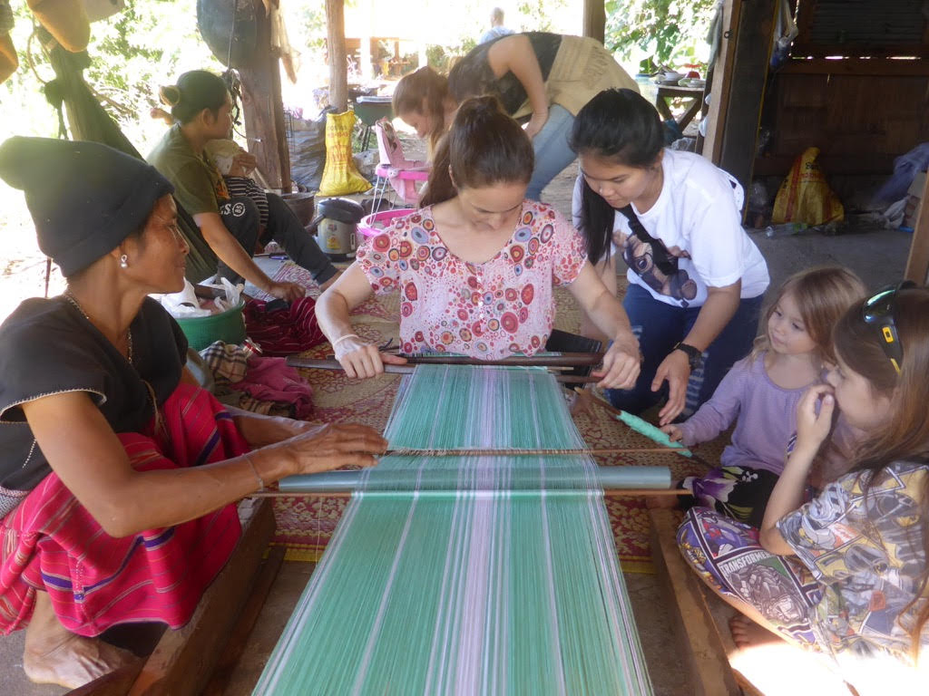 Learning traditional weaving during our homestay in Huay Pakoot, Northern Thailand
