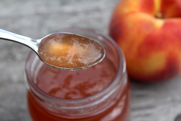 Spoonful of homemade peach jelly