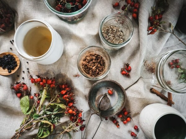 Ingredients for rose hip immunity tea spread out on a table.