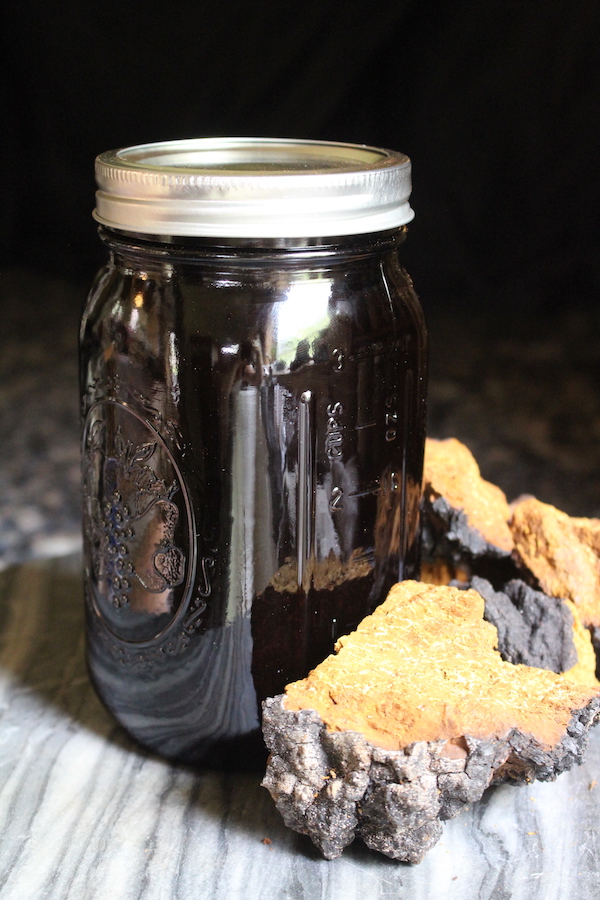 Chaga tincture infusing in a light blocking amber mason jar