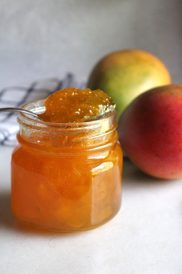 Homemade Mango Jam ~ This simple mango jam recipe is an easy way to preserve mangoes at home with just a few ingredients. All you need is a bit of chopped mango, sugar, citrus and patience. No pectin required!
