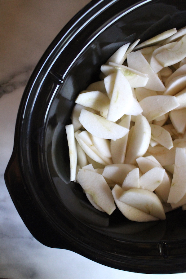 Sliced apples in a crock pot is the first step to making apple butter at home