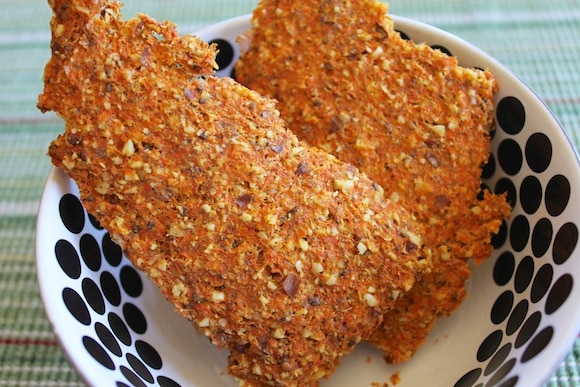 Carrot Juice pulp crackers made using leftover carrot pulp on a silicone mat in a food dehydrator