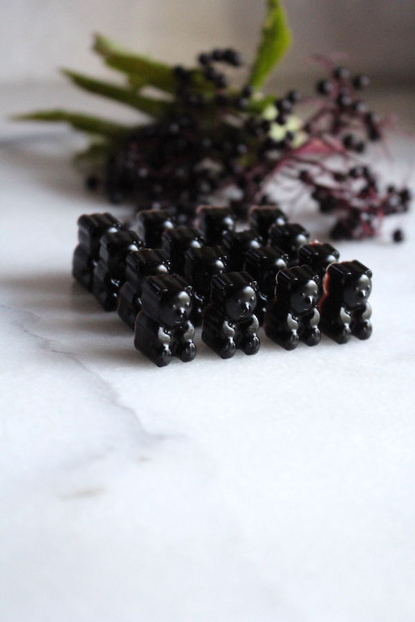 Elderberry gummy bears made from elderberry syrup, including raw honey.