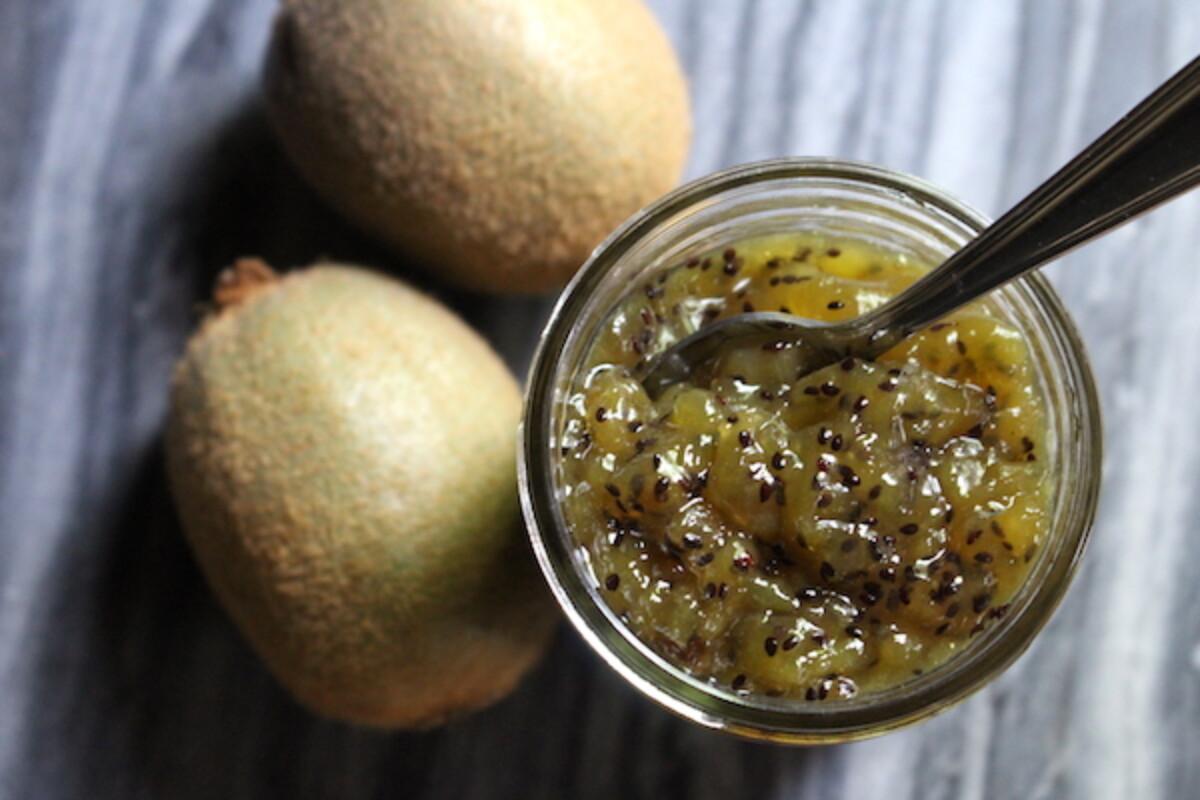 open jar of homemade kiwi jam showing the thick texture without added pectin