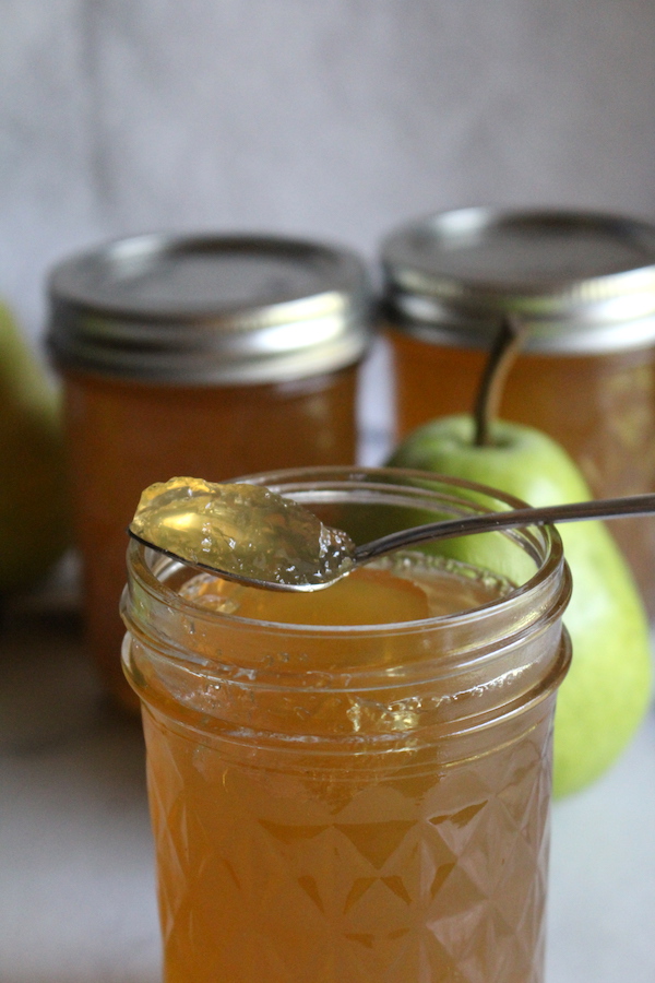 homemade pear jelly on a spoon