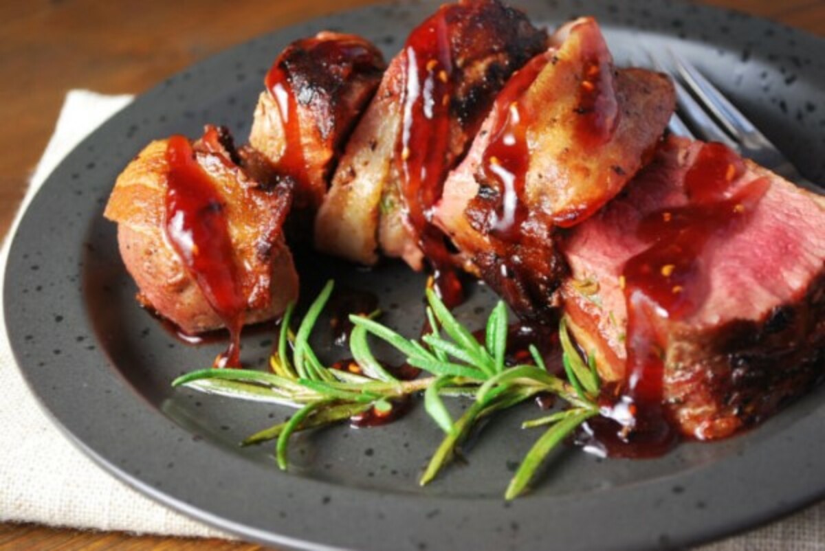 Applewood Bacon-Wrapped Venison Loin with Raspberry Sauce