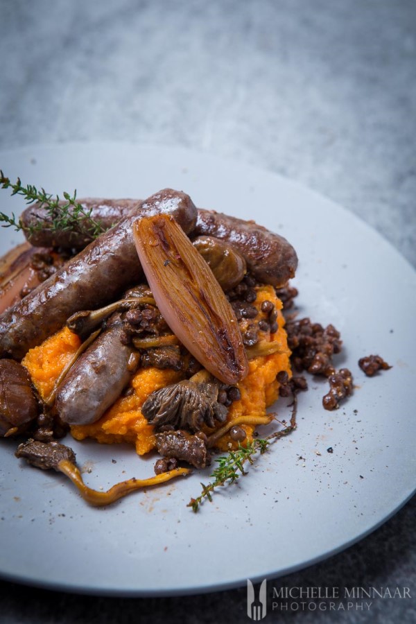 venison sausage casserole with mushrooms, lentils and chestnuts