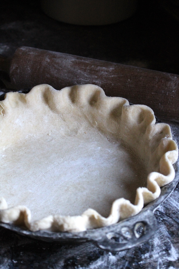 Unbaked Bottom Pie Crust - Used coffee grounds can help you bake an empty pie shell without losing its shape.