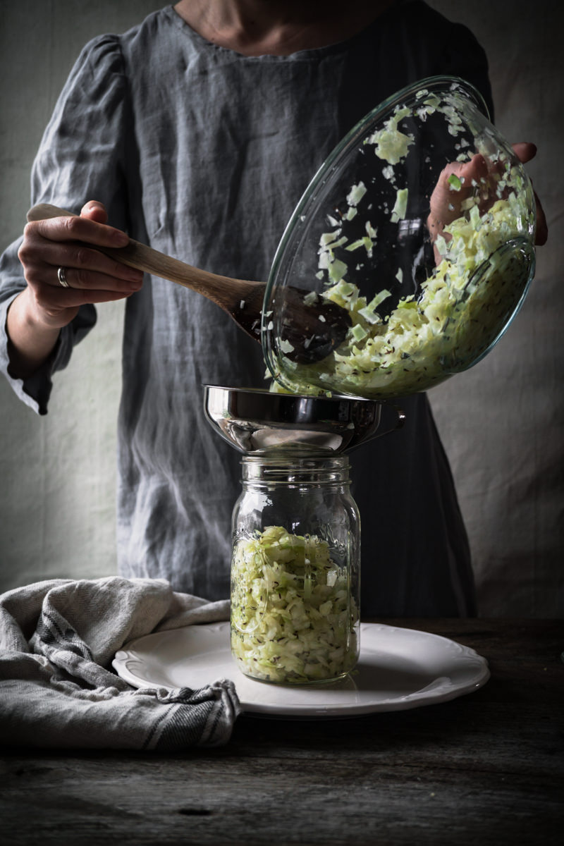 Adding Cabbage to Sauerkraut Fermentation Vessel