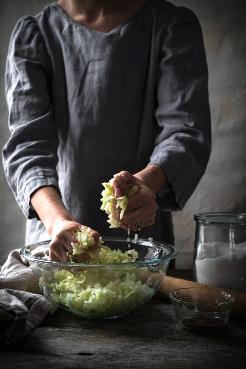 Massaging Homemade Sauerkraut by Hand