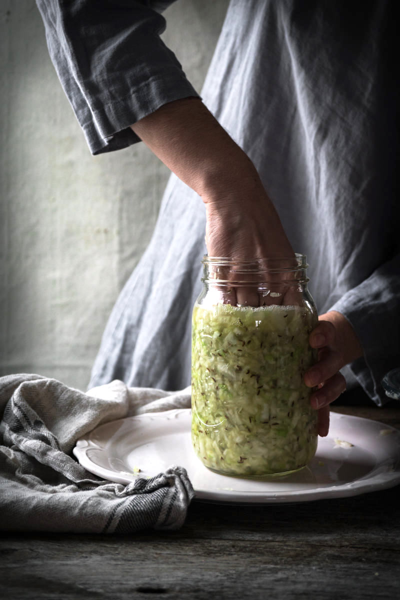 Pressing Sauerkraut into Jar