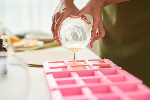 pouring soap into silicone bar molds