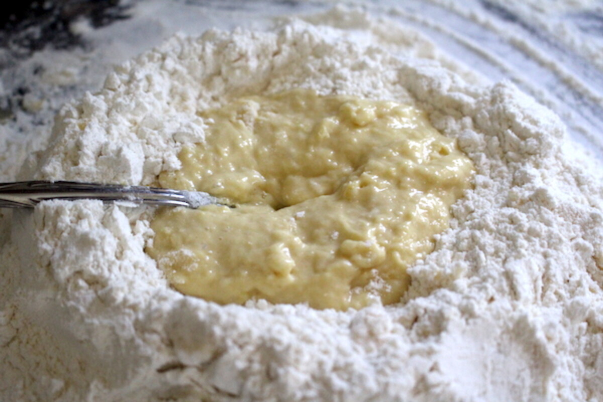 Beating eggs into flour for pasta from scratch