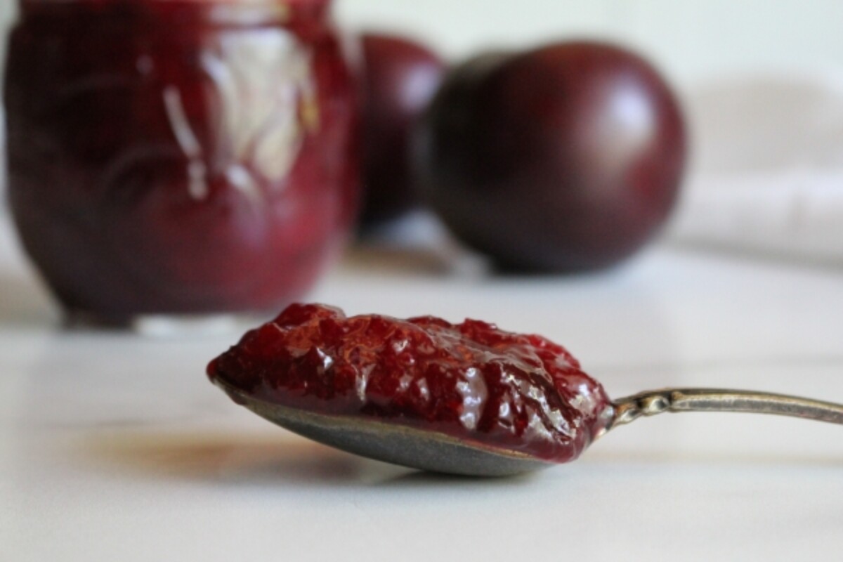 Thick spoonful of plum jam, made without added pectin