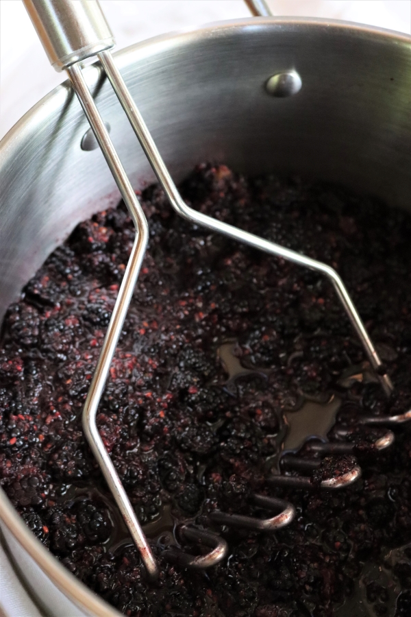 Mashing Blackberries to extract juice for Jelly