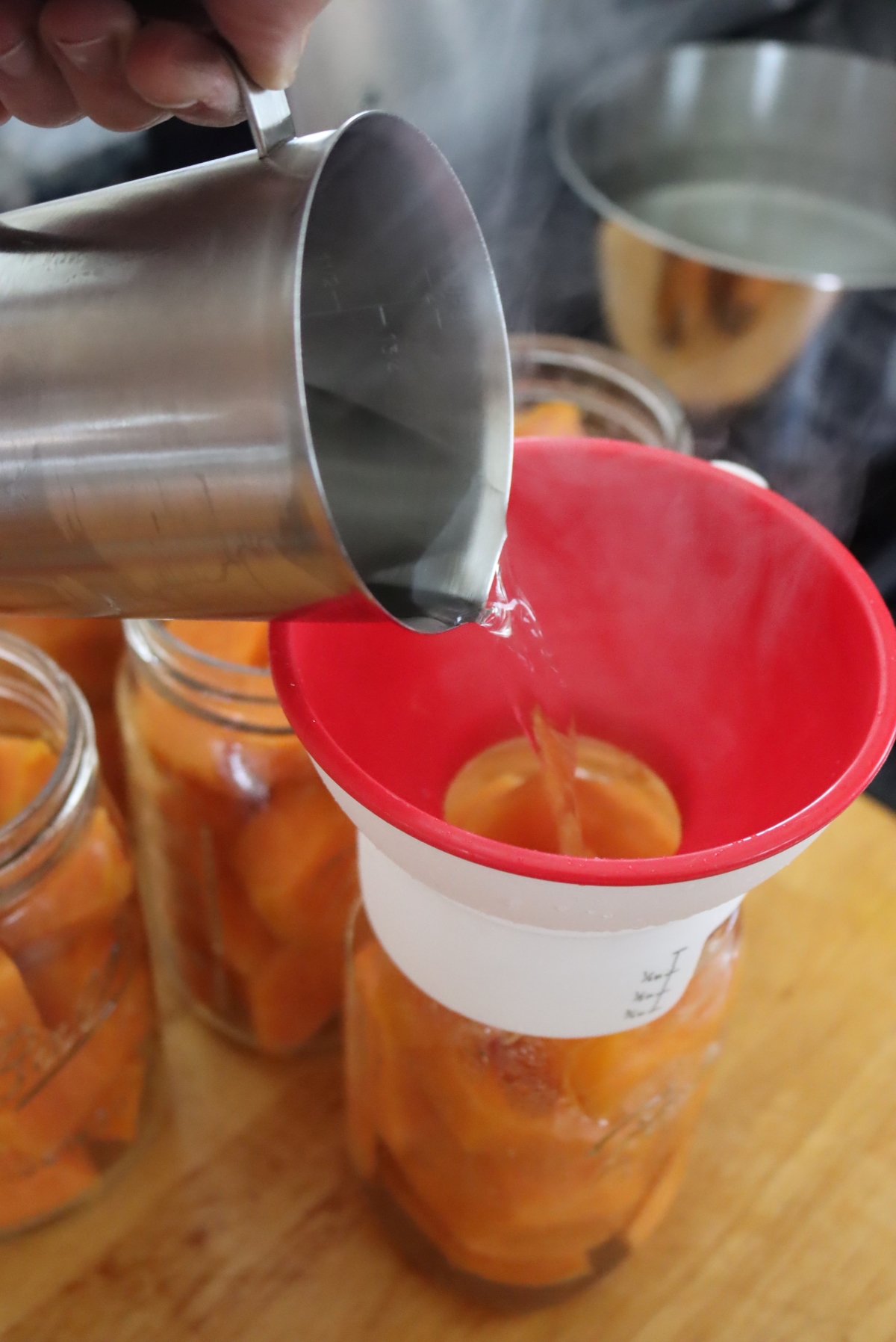 Adding Syrup to Sweet Potatoes for Canning