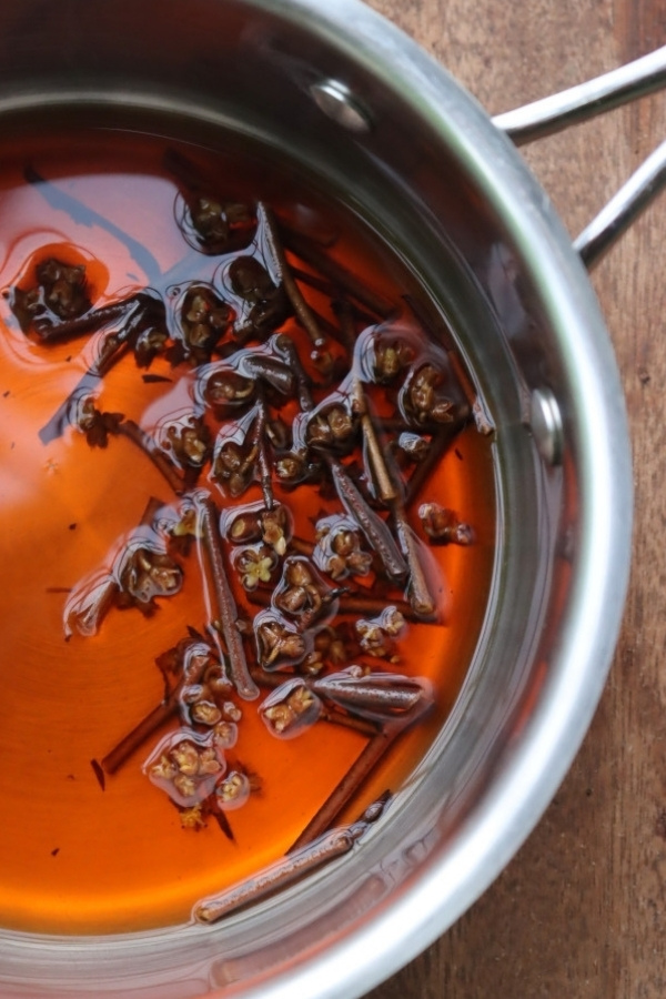 Simmering witch hazel twigs to make a decoction (fresh water extract)