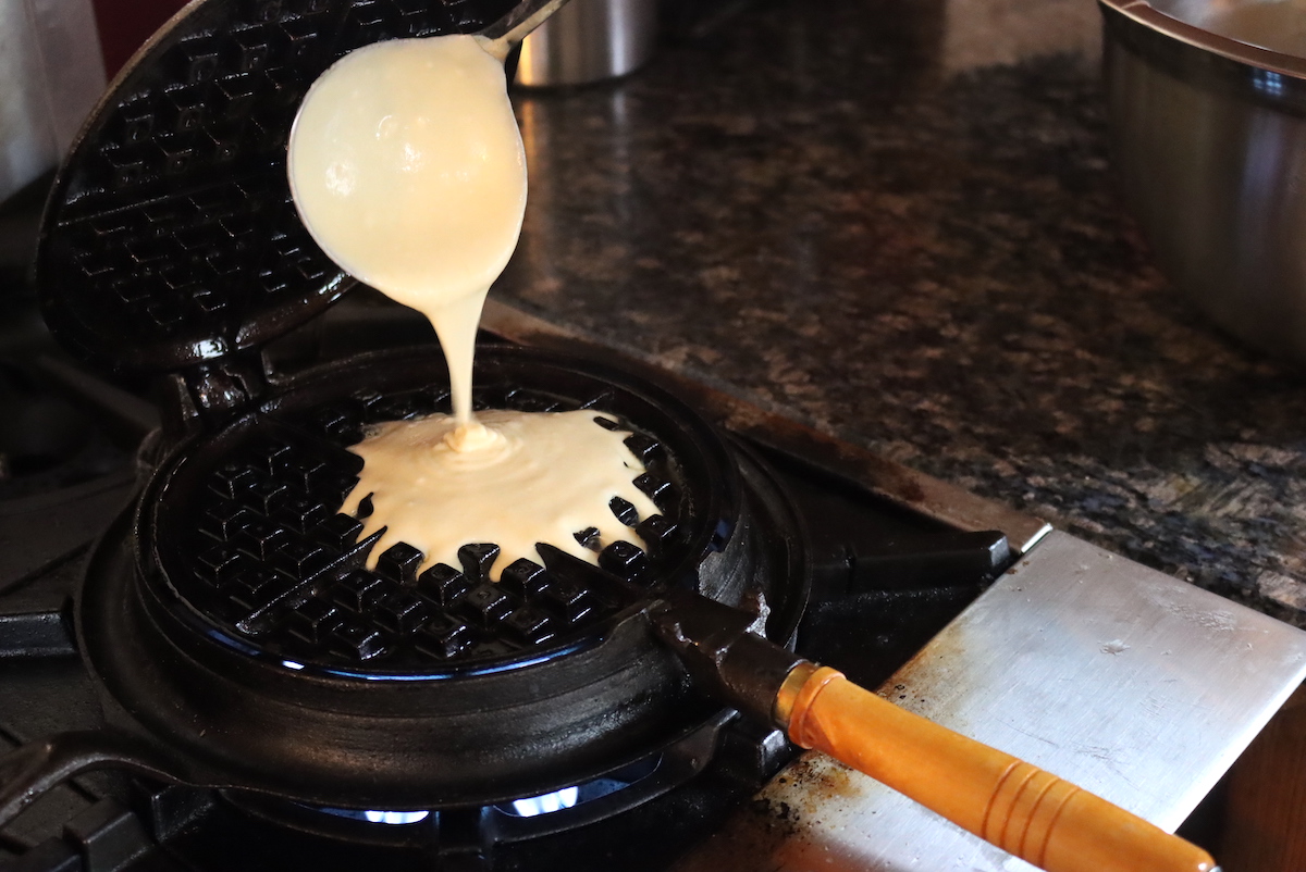 Pouring Waffle Batter into Stovetop Waffle Maker