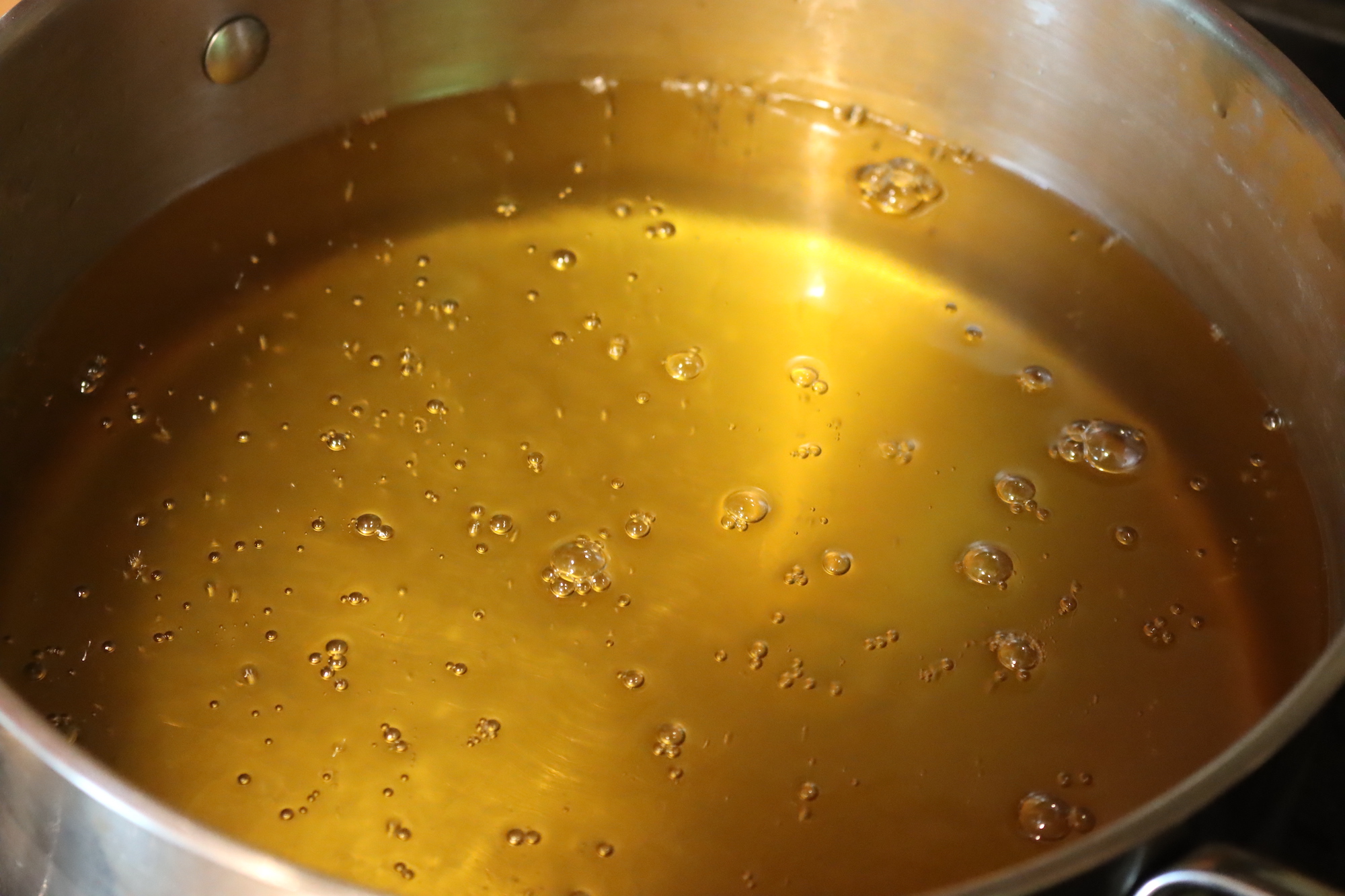 Tallow oil bubbling as it renders