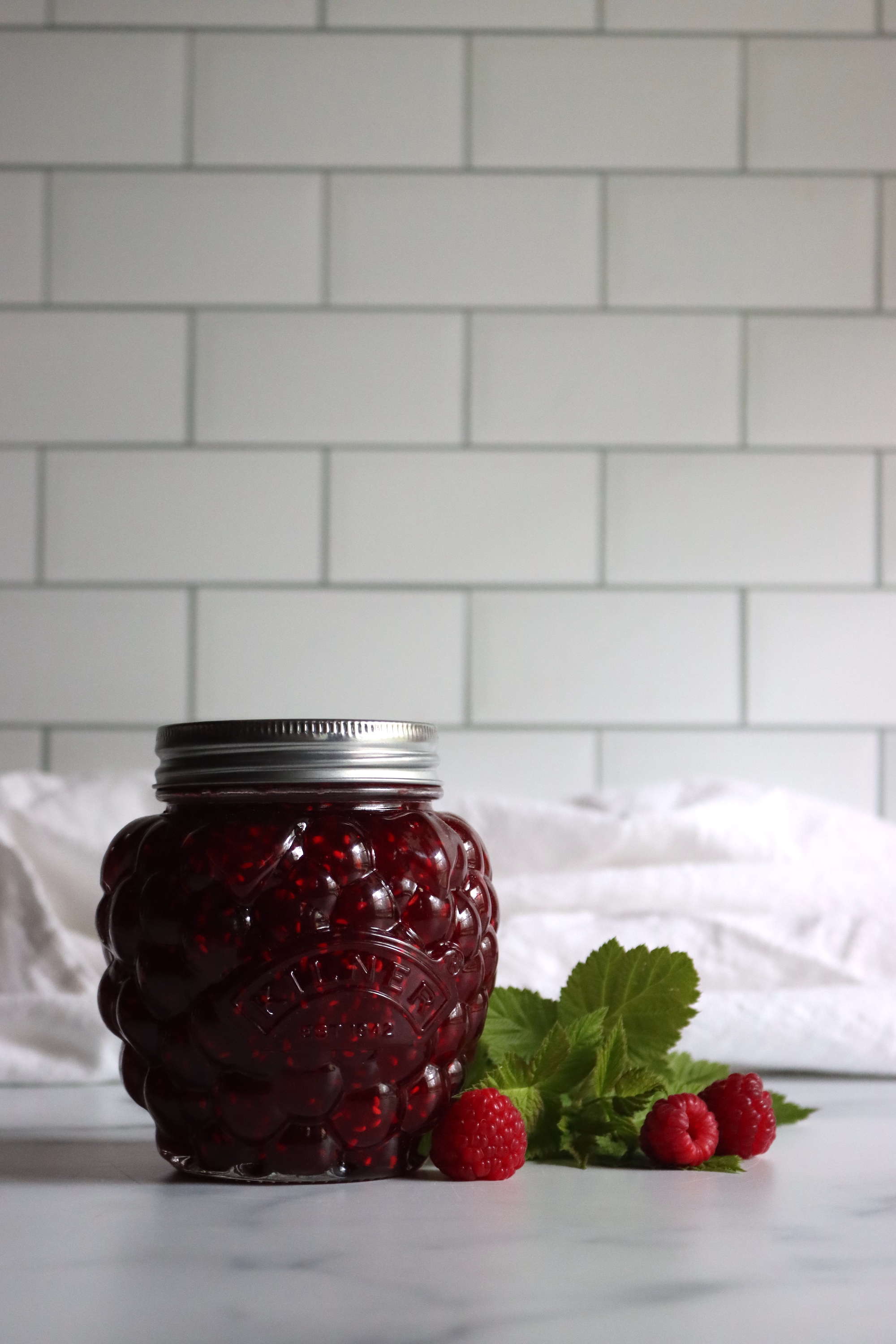 Jar of homemade raspberry jam