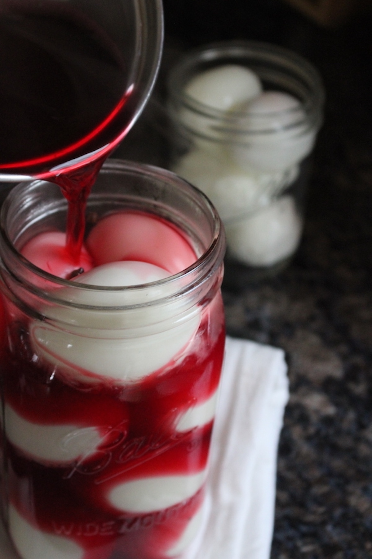 Pouring Brine on Pickled Eggs